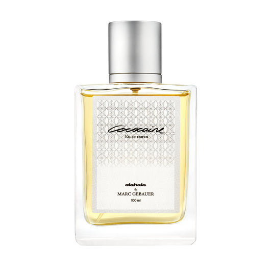 Cococaine Eau de Parfum Flasche mit schwarzem Deckel, zeigt ein elegantes Design. Exklusiver sommerlicher Kokosduft von OLAKALA, inspiriert von Marc Gebauer und Nicolas Lazaridis.